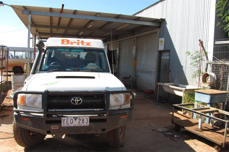 Photo: Not a picturesque photo but a real event - Martijn and Nicole getting a tyre fixed in the Kimberley